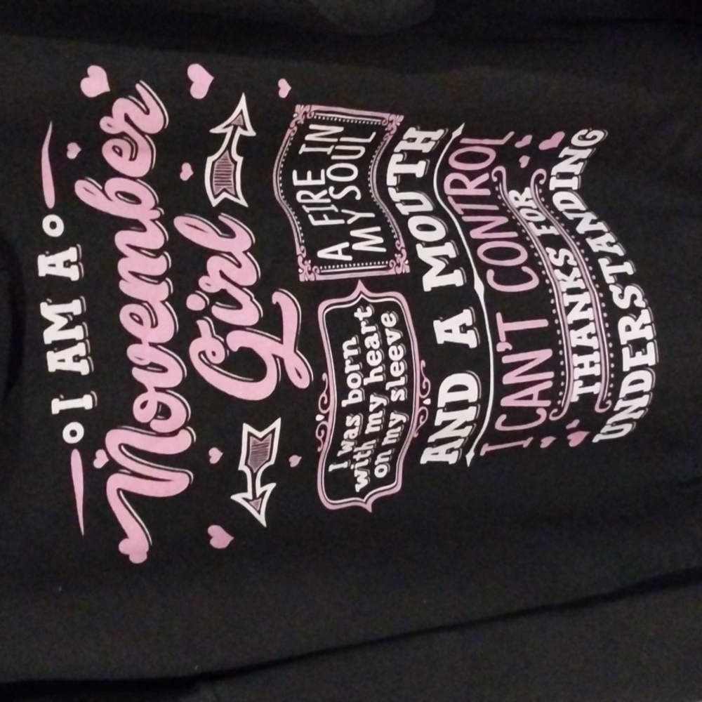BLACK hooded sweatshirt with November saying on the back.